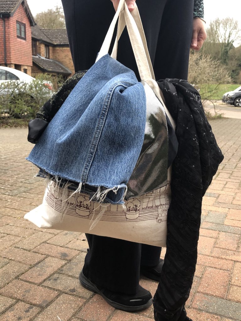 Shopper boasting bagful of second-hand sale finds on way home 