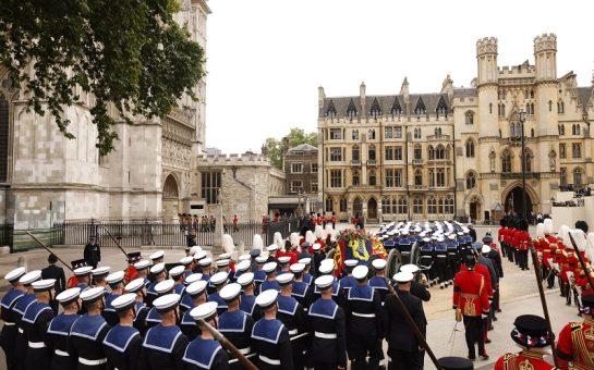 The Queen's coffin is pulled towards Westminster Abbey