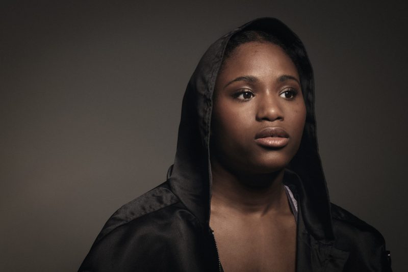 Women's professional boxer Caroline Dubois wearing a boxing robe