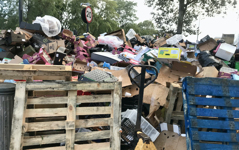 Rubbish piled up to the height of a street post in Tower Hamlets.