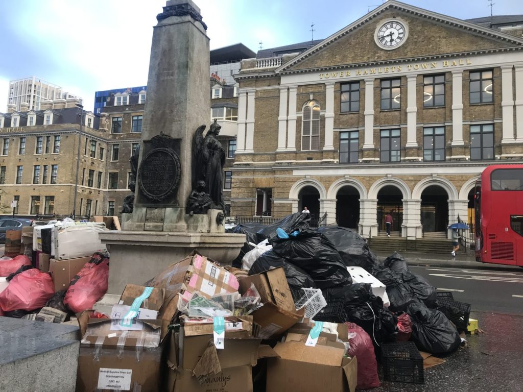 A photo of rubbish piled up outside of Tower Hamlets Town Hall.
