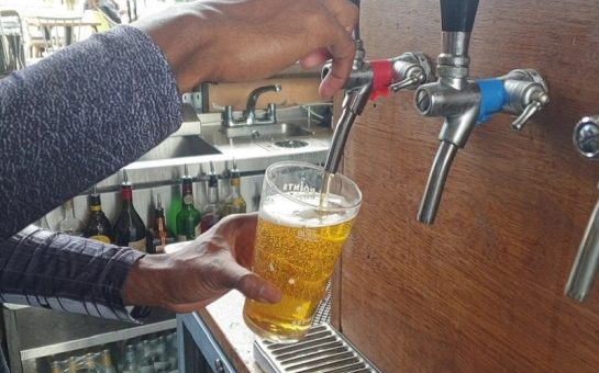 Beer being poured at brewery taproom