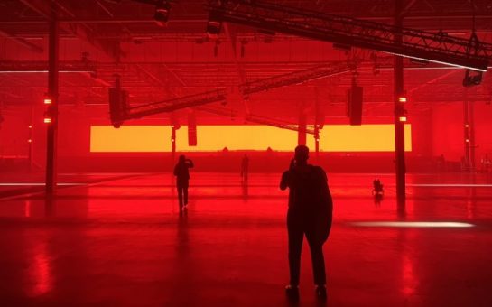 Large club dancefloor bathed in red light