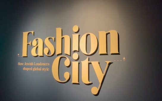 A sign displaying the words "Fashion City: How Jewish Londoners shaped global style"