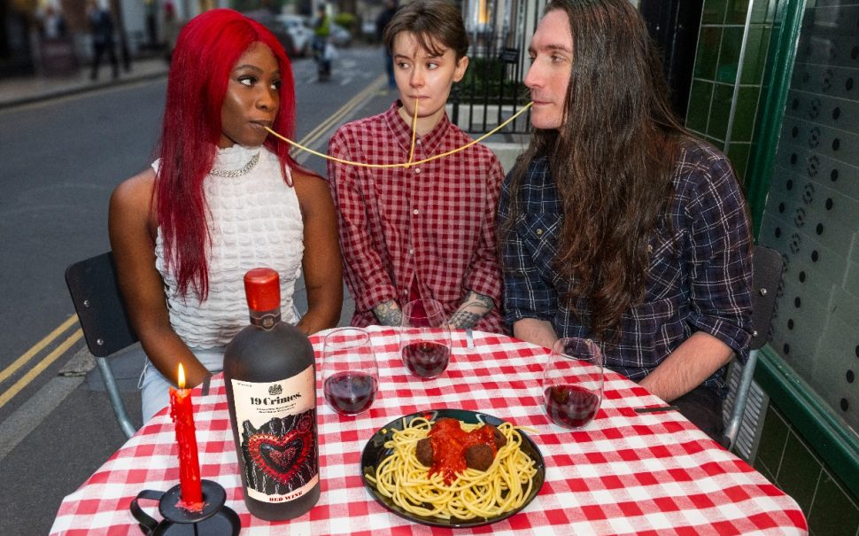 A throuple eating dinner