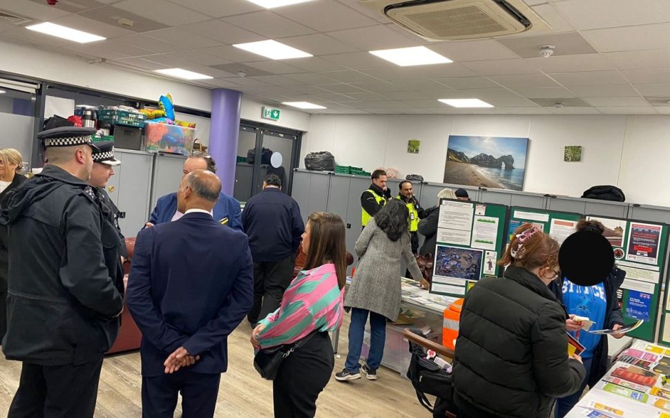 Police officers and members of the public in council building