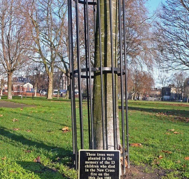 New Cross Fire memorial plaque saying "These trees were planted in the memory of the 13 children who died in the New Cross fire on the 18th Jan 1981".