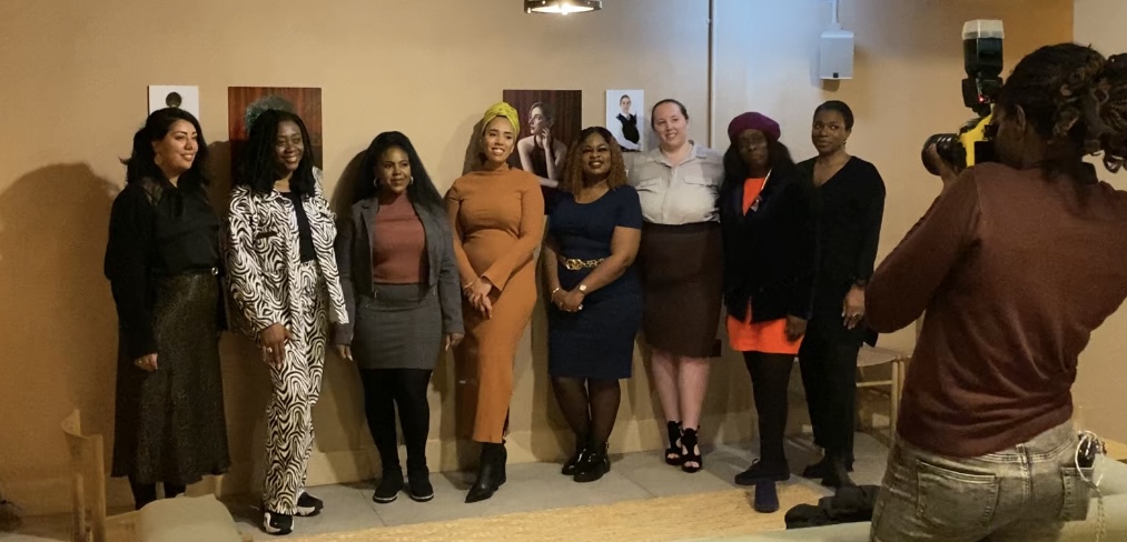 Some of the subjects featured in women on the frontlines stand posed in Buckle Street Studios at the panel event.