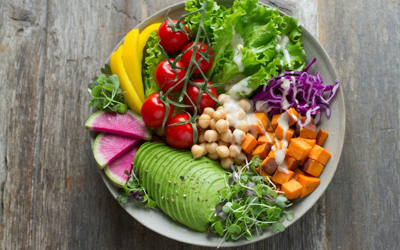 A salad filled with a mix of plants.