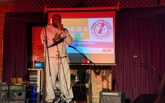 Rapper Reload performing on stage for Waltham Forest Stand Up to Racism