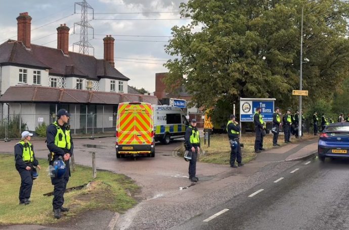 Police officers stationed outside Epping hotel