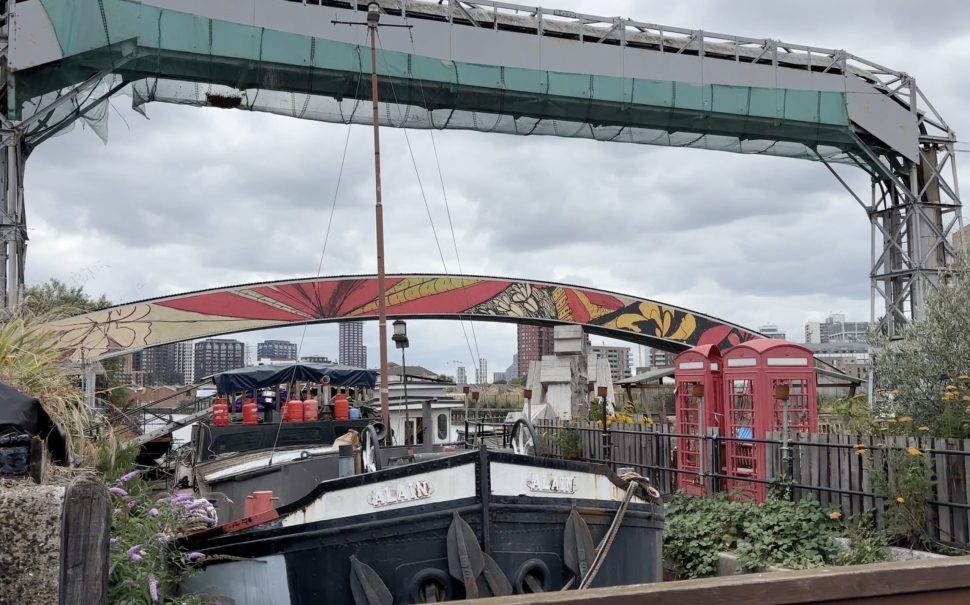 Image of house boat at Cody Dock and colourful bridge