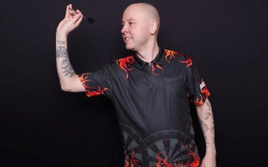 Znutins poses with his signature darts stance