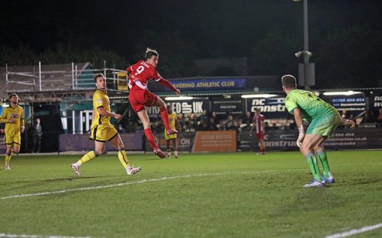 Hornchurch striker Henry Hearn scoring a header
