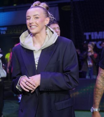 Chloe Kelly walks out ahead of her players before her match against Yanited