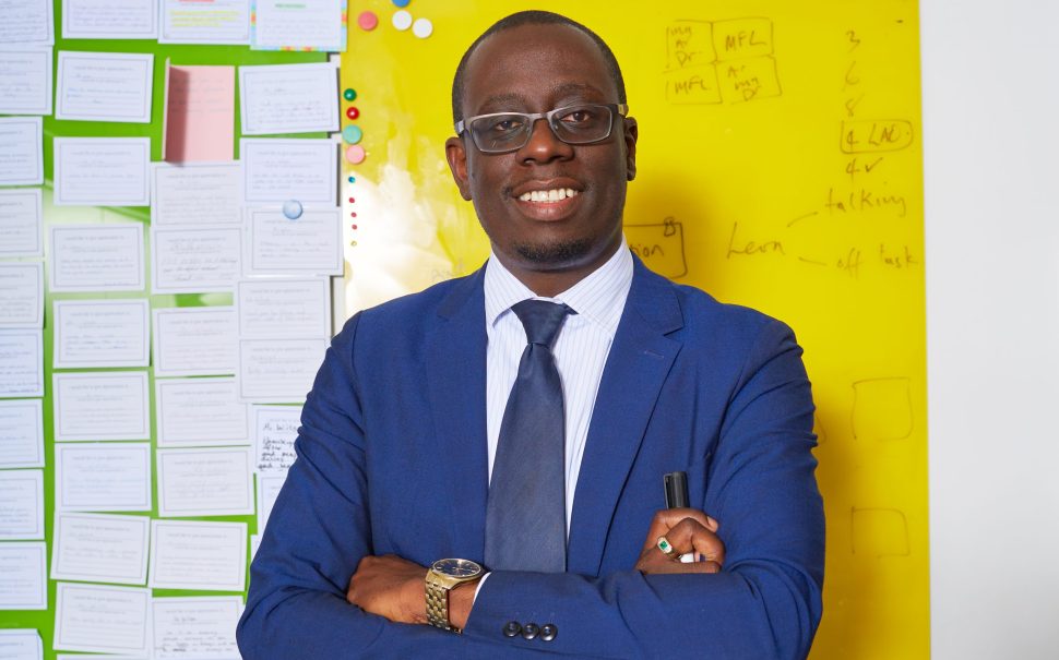 Man posing with his arms folded