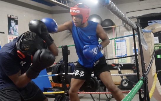 Two young boxers in the ring fighting at the Pedro Club