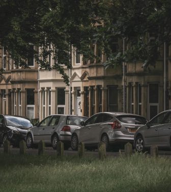 A row of cars parked on a residential street