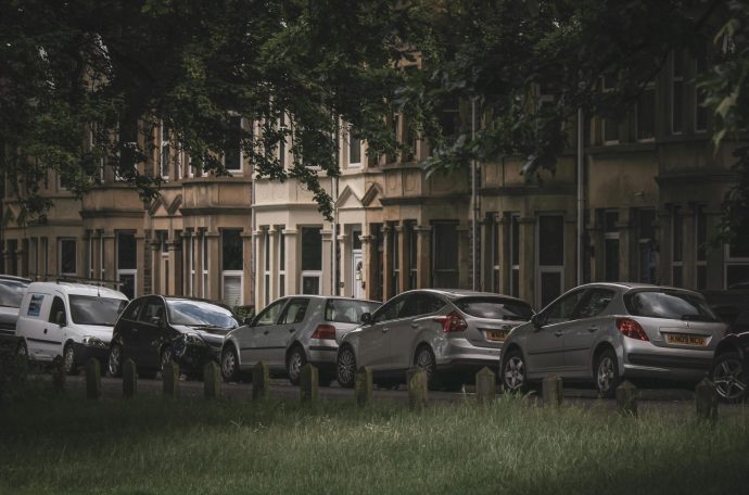 A row of cars parked on a residential street
