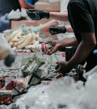 People hand out food in a foodbank