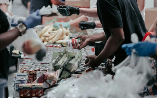 People hand out food in a foodbank