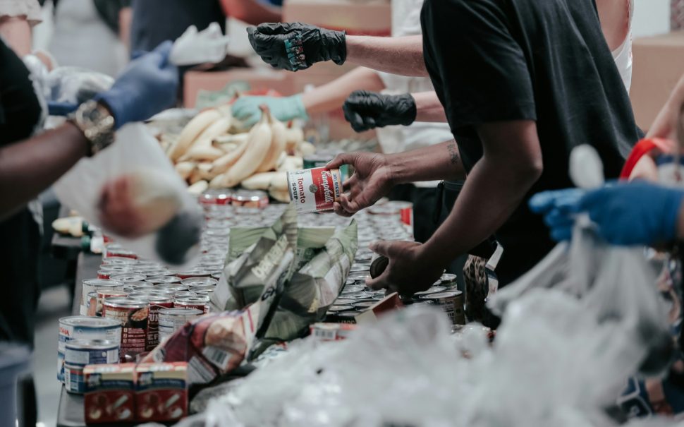 People hand out food in a foodbank