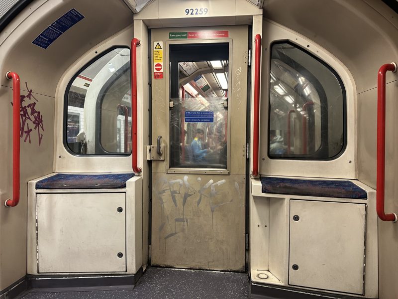 Image of the inside of a London Underground tube train on the central line.