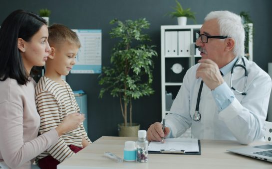 GP Appointment with a mother and her young son.