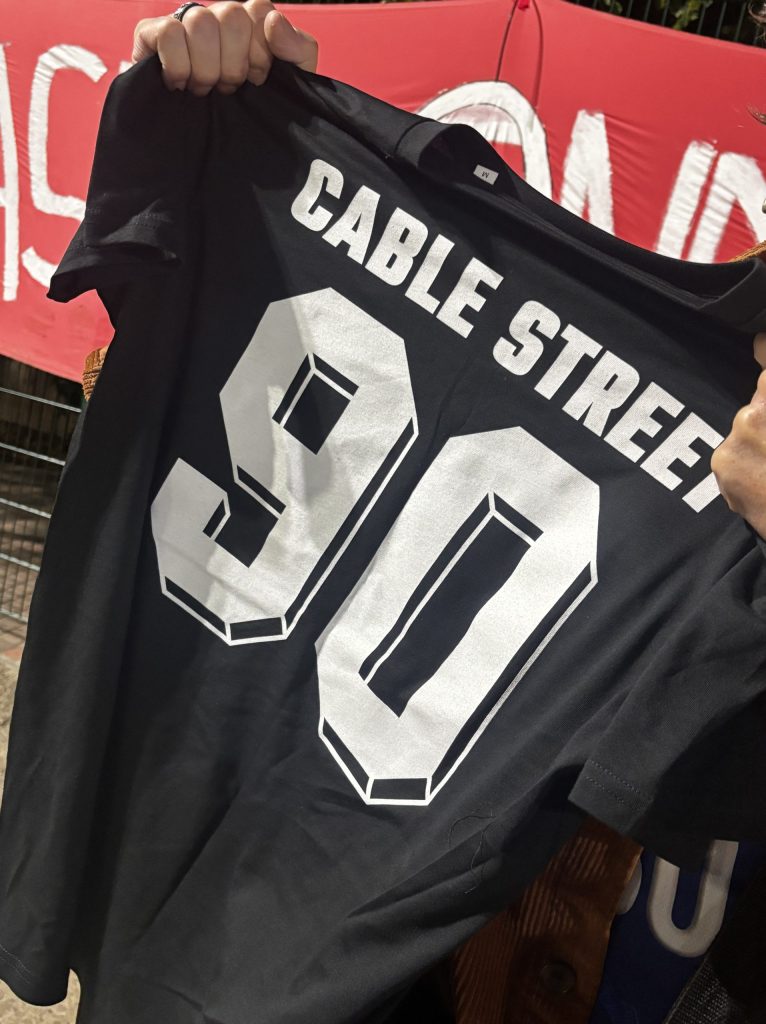 A T-shirt reading "Cable Street" with the number 90