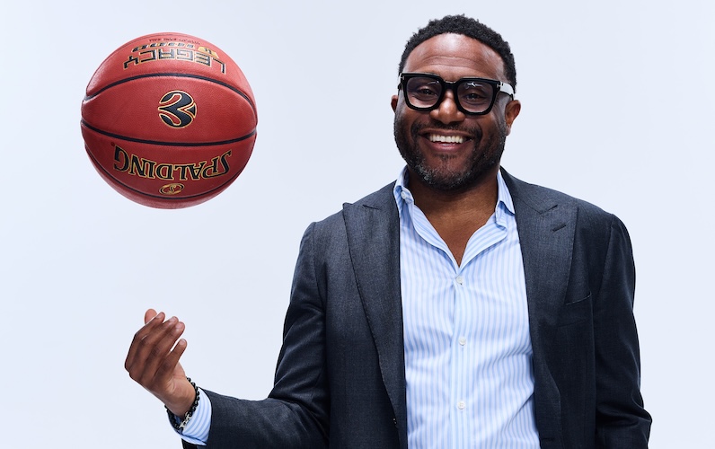 London Lions President, Lenz Balan, throwing a basketball.