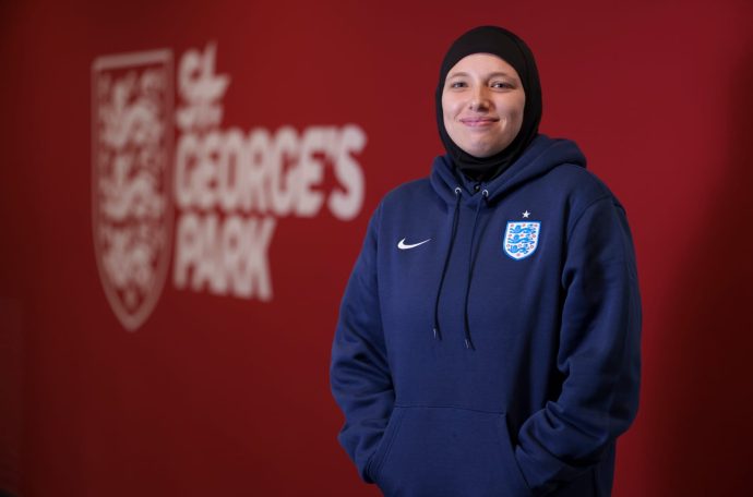 Hijabi coach standing in front of St George's Park sign