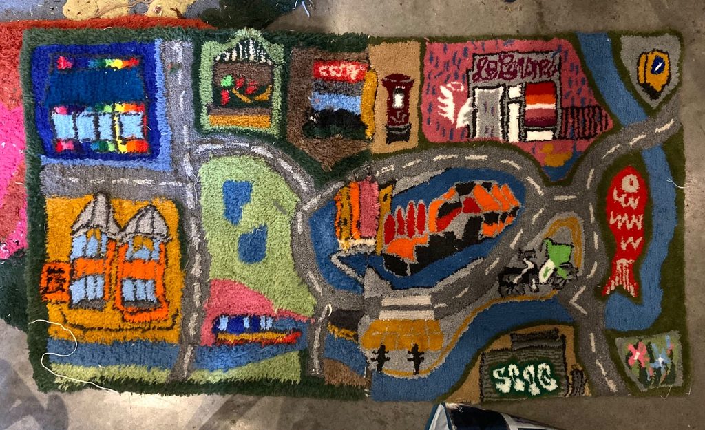 Image of rug created by a Hackney resident during the free workshop, depicting Hackney landmarks