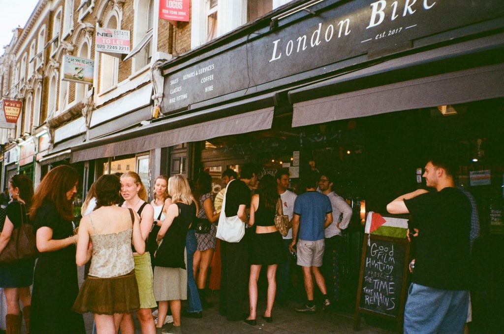 young people gathered outside a venue