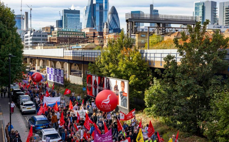 Photograph of the 4 October march through Cable Street, with London skyscrapers in the background