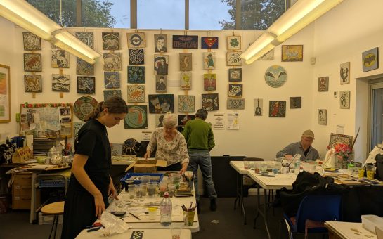 Tessa Hunkin and her volunteers at the Hackney Mosaic Projects, working on commissions at their studio in Hackney Downs pavilion