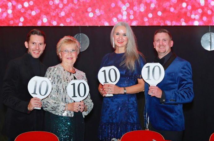The four judges of Strictly St Francis 2025 pose with their scoring panels, all showing 10